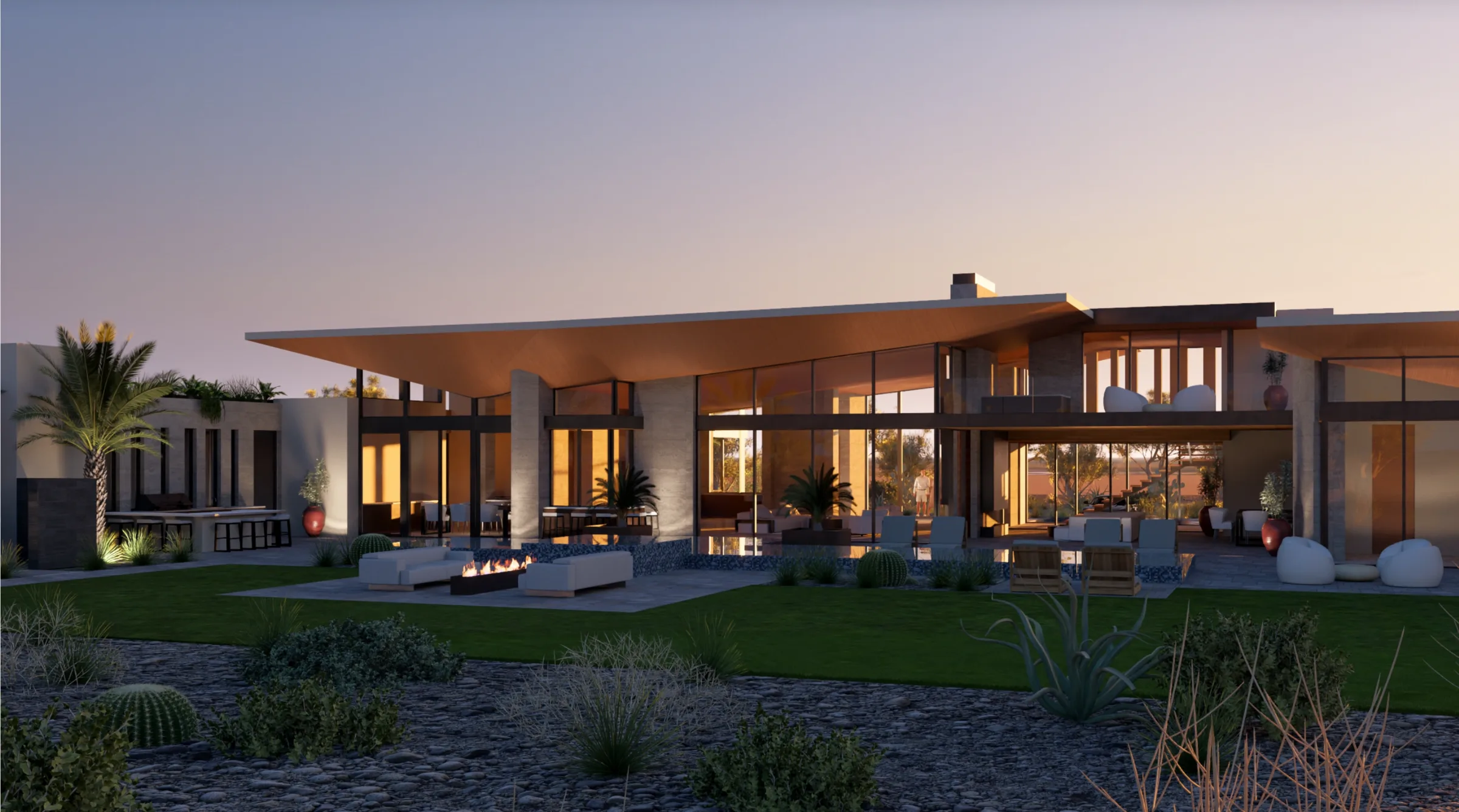 Rear living wall of glass opening to the covered patio at sunset